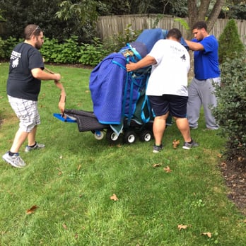 Bennett Piano Movers - Rolling easily through the lawn. - Piano Services Near Me - Atlanta, Georgia