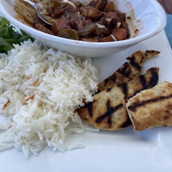 Wahoo's Bistro & Patio - Octopus stew, rice and nan. - Seafood Near Me - Bermuda, Virgin Islands Wahoo's Bistro & Patio - Octopus stew, rice and nan. - Seafood Near Me - Bermuda, Virgin Islands