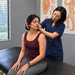 Blissful Wellness Acupuncture & Chiropractic - Personalized neck and shoulder assessment with a focus on patient comfort, movement, and individualized treatment planning.