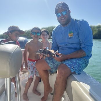 Salty Soul Charters - My 9 year old with his first fish (and Captain Chase, who he admired very much) - Boat Charters Near Me - Key West, Florida Salty Soul Charters - My 9 year old with his first fish (and Captain Chase, who he admired very much) - Boat Charters Near Me - Key West, Florida