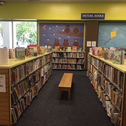 Clean and organized bookshelves in the kids section
