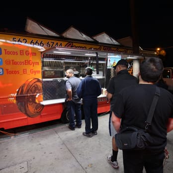 Tacos El Gym - a group of people standing in front of a food truck - Food Trucks Near Me - Long Beach, California Tacos El Gym - a group of people standing in front of a food truck - Food Trucks Near Me - Long Beach, California