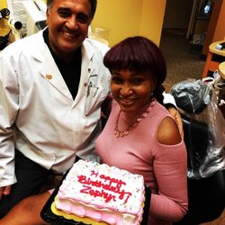 Deldar Dental - Noblesville dentist, Dr. Mike Deldar with one of his long-time patients celebrating her birthday.