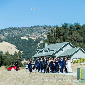 Avant Garde Kinema Studio - Alex flying his drone while the wedding party approaches the ceremony site. Such a beautiful scene! - Video/Film Production Near Me Avant Garde Kinema Studio - Alex flying his drone while the wedding party approaches the ceremony site. Such a beautiful scene! - Video/Film Production Near Me