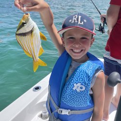 The smile says it all! Family fishing fun!