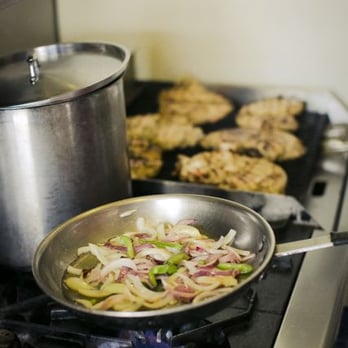 The Wrap Shack - a pan of food cooking on the stove - New American Near Me - Gallatin Gateway, Montana
