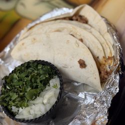 El Dos Mexican Restaurant - Al pastor tacos lacks the expected flavor.