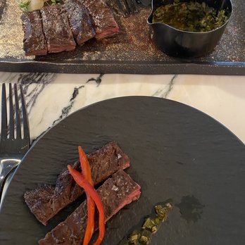 Giselle Miami - Skirt steak with chimichurri - Mediterranean Near Me - Miami, Florida Giselle Miami - Skirt steak with chimichurri - Mediterranean Near Me - Miami, Florida