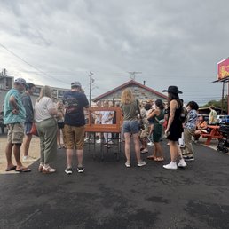 Everyone gathering around to see the chicken.