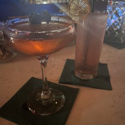 Perfectly balanced drinks. A Manhattan and the bartenders twist on a blood orange Tom Collins.
