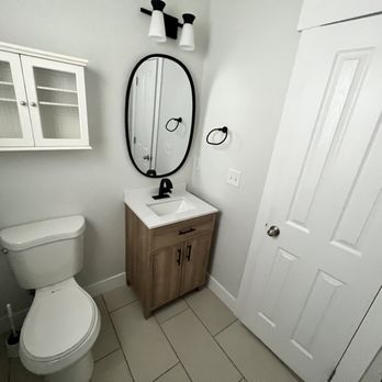 GTM Contractors - a bathroom with a toilet and sink - General Contractors Near Me GTM Contractors - a bathroom with a toilet and sink - General Contractors Near Me