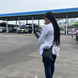 Megabus - Passengers De-board the bus and wait in the hot sun while drivers fills the gas tank. We are already 28 minutes late.