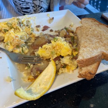 Keke's Breakfast Cafe - Half eaten egg bowl with toast - the toast is so big and yummy - American Near Me - Tampa, Florida