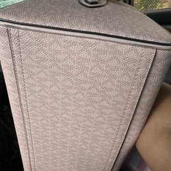 Michael Kors - Scratches clear as day and she wouldn't even clean off my bag
