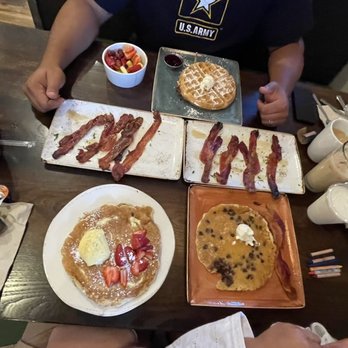 First Watch - Lemon pancakes , chocolate chip pancakes , bacon , waffle , fruit bowl - Breakfast & Brunch Near Me - Round Rock, Texas First Watch - Lemon pancakes , chocolate chip pancakes , bacon , waffle , fruit bowl - Breakfast & Brunch Near Me - Round Rock, Texas