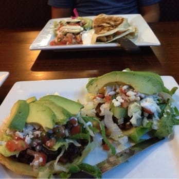 Morazan Restaurant - Sopes and quesadilla mixta in the background - Mexican Near Me - Charlotte, North Carolina Morazan Restaurant - Sopes and quesadilla mixta in the background - Mexican Near Me - Charlotte, North Carolina