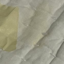 Pottery Barn - Blanket - stain next to masking tape