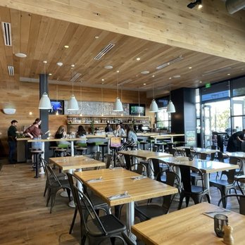 True Food Kitchen - Seating area near the front door and bar - New American Near Me - Palo Alto, California True Food Kitchen - Seating area near the front door and bar - New American Near Me - Palo Alto, California