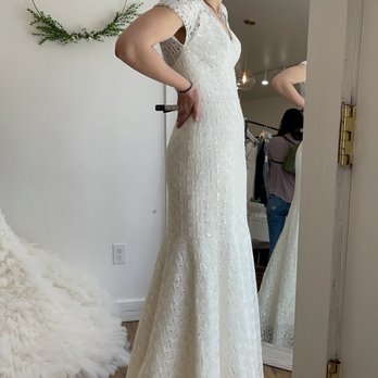 Brides for a Cause - Showing off another dress in the natural light of the storefront window - Bridal Near Me