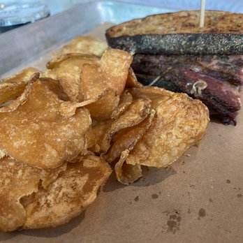 Rye Deli & Drink - 1/2 Pastrami Reuben (way to salty) w/kettle chips (very good) - Delis Near Me - Chicago, Illinois