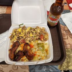 Jerk Flavas Restaurant - I had the Ackee & Saltfish Spicy with extra cabbage and plantains.  Tayia was our cook/server. And she was amazing!