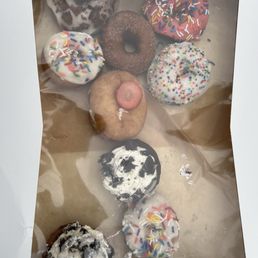 Box received with 9 out of twelve donuts