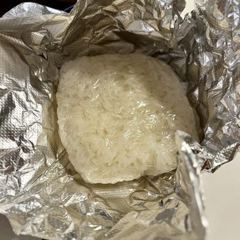Tida Thai - Sticky rice (regular, not dessert) - wrapped in plastic wrap and then in foil for takeout order - Thai Near Me - Newport News, Virginia Tida Thai - Sticky rice (regular, not dessert) - wrapped in plastic wrap and then in foil for takeout order - Thai Near Me - Newport News, Virginia