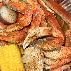 Live Crawfish & Seafood - Wednesday special buy 1lb get a pound 50% off snow crabs and Dungeness crab with signature sauce corn and potato