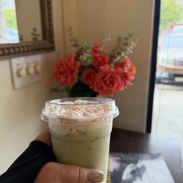 Iced matcha latte with strawberry cold foam to go