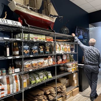 O'Donnell's Market - a man looking at a model of a ship - Seafood Markets Near Me - Potomac, Maryland O'Donnell's Market - a man looking at a model of a ship - Seafood Markets Near Me - Potomac, Maryland