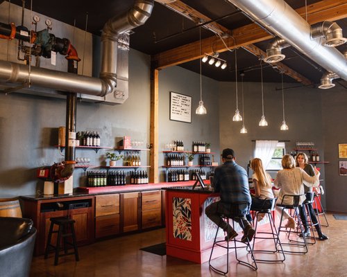 Photo of Covington Cellars - Woodinville, WA, US. people sitting at the bar