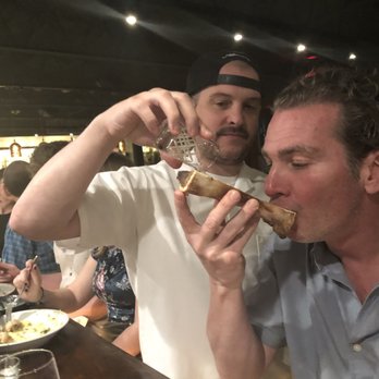 Riel - Chef Ryan serving Whiskey bone marrow shot right on the spot. - New American Near Me - Houston, Texas Riel - Chef Ryan serving Whiskey bone marrow shot right on the spot. - New American Near Me - Houston, Texas