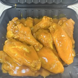 Big Will’s Kitchen - 10 piece wings tossed in hot and golden bbq sauce.