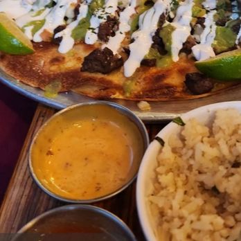 The Neighborhood Bar OG - Caramelo Pizza with a side of rice. - Sports Bars Near Me - Tucson, Arizona The Neighborhood Bar OG - Caramelo Pizza with a side of rice. - Sports Bars Near Me - Tucson, Arizona