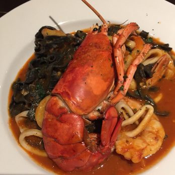 Osteria - Squid Ink Pasta with lobster, calamari, shrimp, scallops. Beautiful presentation and delicious! - Italian Near Me - Greensboro, North Carolina