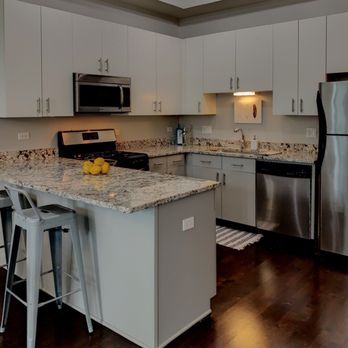 Molly Marino - Baird & Warner - Kitchen cabinets painted grey to be more in line with current trends. Lighting brightened. - Real Estate Agents Near Me - Chicago, Illinois Molly Marino - Baird & Warner - Kitchen cabinets painted grey to be more in line with current trends. Lighting brightened. - Real Estate Agents Near Me - Chicago, Illinois