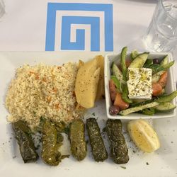 Arahova - Dolmades Plate, greek salad, greek potatoes , rice, rice and lamb wrapped in grape leaves.