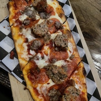 Chuck Lager America's Tavern - Meat lovers Pizza - Bars Near Me - Wesley Chapel, Florida