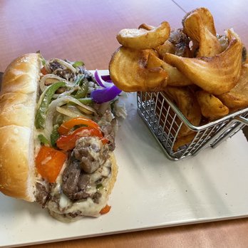 Guieb Cafe - Philly cheesesteak sandwich with sidewinders - New American Near Me - Honolulu, Hawaii Guieb Cafe - Philly cheesesteak sandwich with sidewinders - New American Near Me - Honolulu, Hawaii