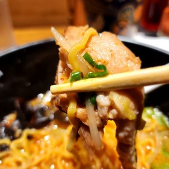 Tomizo Ramen - a close up of a forkful of ramen with chopsticks - Ramen Near Me - Gardena, California Tomizo Ramen - a close up of a forkful of ramen with chopsticks - Ramen Near Me - Gardena, California