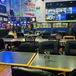 Bull Shooters - Seating area to the left side of the entrance where they have outside patio