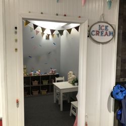 Quincy Children’s Museum - The play city has various storefront with themed toys inside.