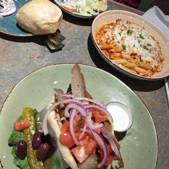 Christos  - West Lafayette - Front: Gyro Top right: Baked Penne w/ grilled chicken at extra cost. Top left: Roll that came with salad above it - American Near Me - West Lafayette, Indiana