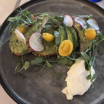 Ostra - Avocado toast with poached egg. - New American Near Me - San Antonio, Texas