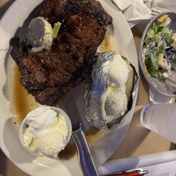 Big Mike's Steakhouse - Ribeye, baked potato with butter and sour cream - Steakhouses Near Me - Orange Beach, Alabama Big Mike's Steakhouse - Ribeye, baked potato with butter and sour cream - Steakhouses Near Me - Orange Beach, Alabama