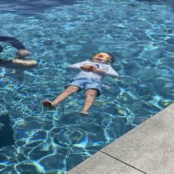 Happy Shark Swim Lessons - Three year old student practicing back floating independently.