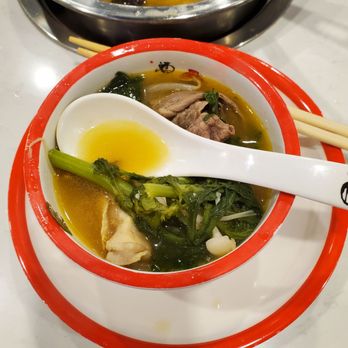 Dragon Hot Pot & BBQ - a bowl of soup with chopsticks - Hot Pot Near Me - West Palm Beach, Florida Dragon Hot Pot & BBQ - a bowl of soup with chopsticks - Hot Pot Near Me - West Palm Beach, Florida