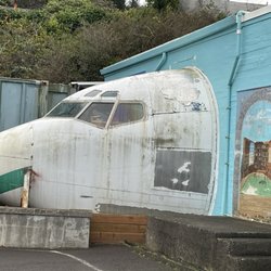 Robert's Bookshop - Airplane nose projecting out of the side of a building