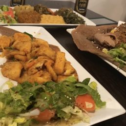 Fish with all 6 veggies and the MELI plate. With Ethiopian beer. Fish with all 6 veggies and the MELI plate. With Ethiopian beer.