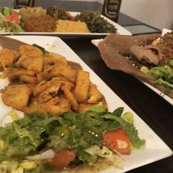 Mela Restaurant & Lounge - Fish with all 6 veggies and the MELI plate. With Ethiopian beer. - Hookah Bars Near Me - Decatur, Georgia Mela Restaurant & Lounge - Fish with all 6 veggies and the MELI plate. With Ethiopian beer. - Hookah Bars Near Me - Decatur, Georgia